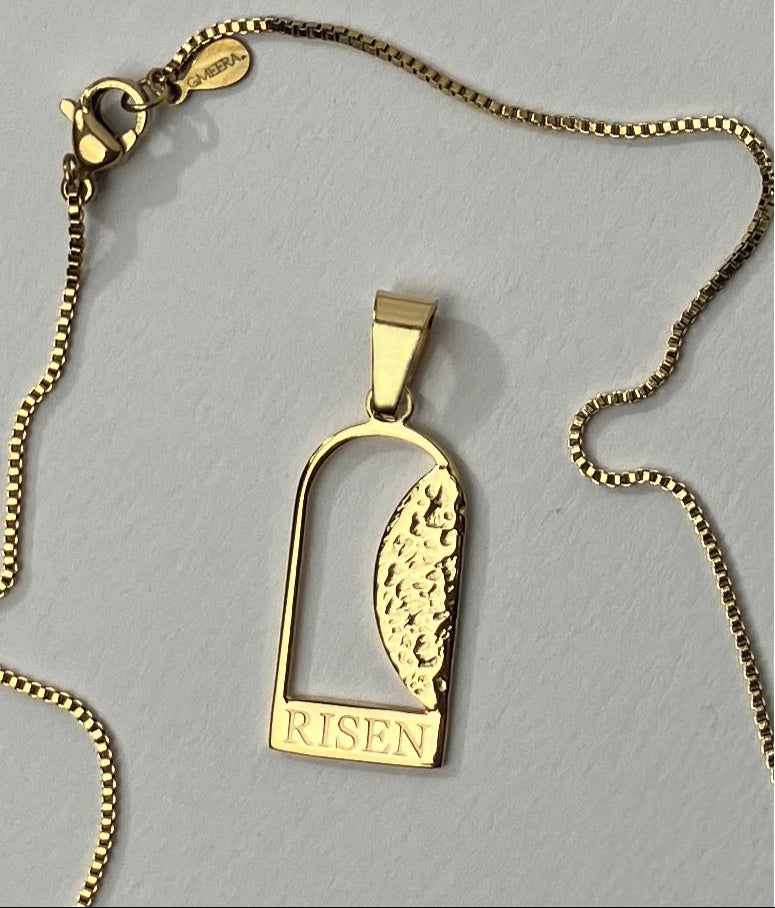 Empty Tomb pendant, stainless steel, gold color, size 12mm x 23mm H, extended base, inscribed "RISEN" font Times New Roman, textured stone. (CHAIN SOLD SEPARATELY.)