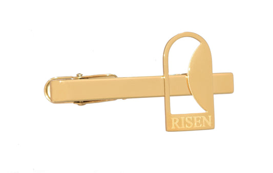 Empty Tomb tie clip, stainless steel, gold color, size 12mm x 23mm H, extended base, inscribed "RISEN" font Times New Roman, smooth stone